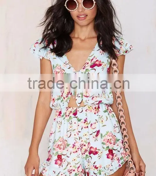 Light Blue Colorful Floral Print Romper Tie Closure At Neck Above Cutout & Ruffled Detailing At Hem And Sleeves photo-2