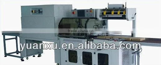 Shrink wrapping machine
