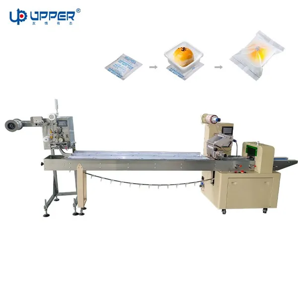 Flow packaging machine with pouch dispenser