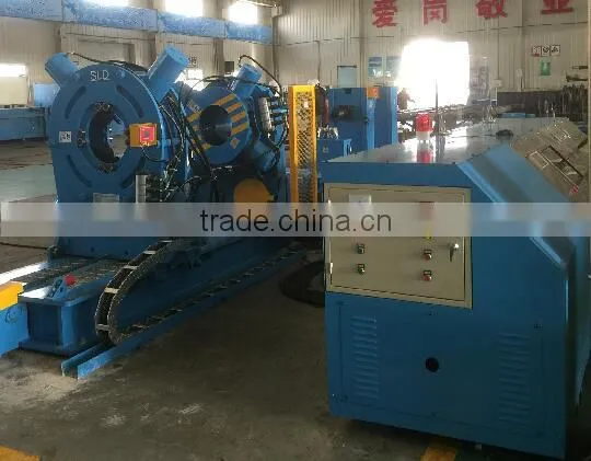 Downhole tool makeup/breakout machine