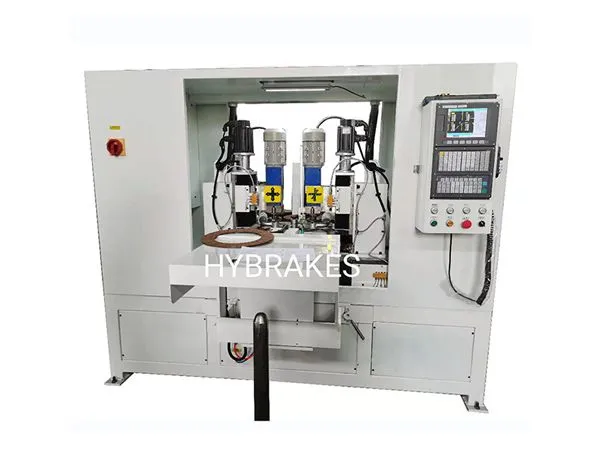 CLUTCH FACING MACHINE