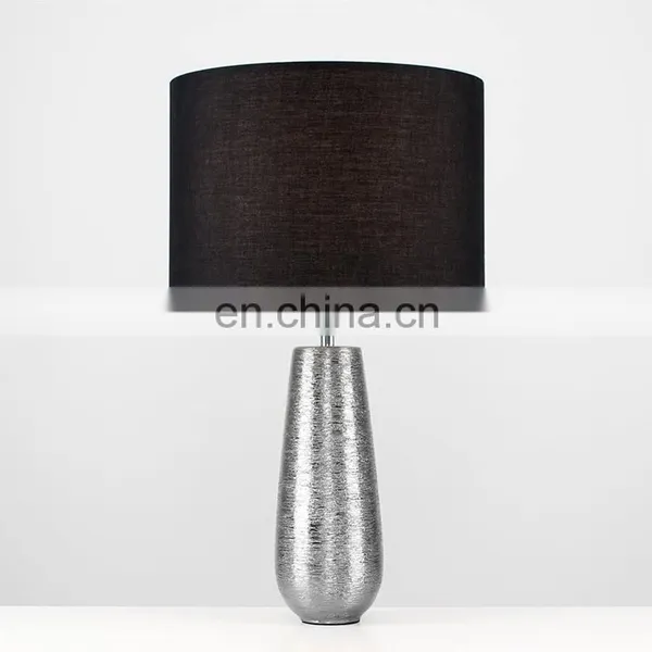 Korea Custom Cheap Ceramic Base Unique Fancy Carved Surface Silver Cylinder Bedside Lamp With Logo photo-3