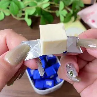Сыр La vache qui rit / Kiri. Машина для обработки сыра с гибкой алюминиевой фольгой Tokkepack