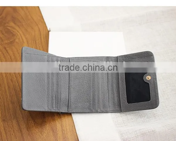 Guangzhou Factory Cowhide Leather Hand Pouch Short Wallet Triple Wallet for Ladies photo-6