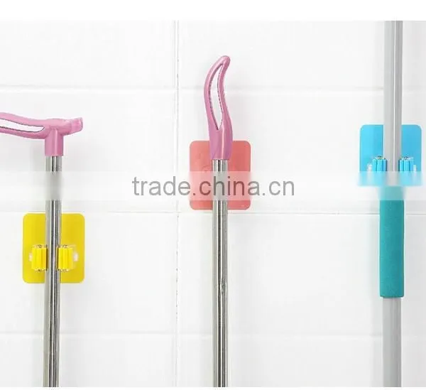 Wholesale Stock Magic Wall Suction Plastic Mop Handle Storage Holder photo-3