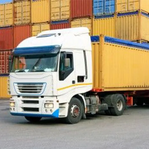Seamless Logistics Integration: Cranes, Straddle Carriers, and Freight Vehicles photo-2