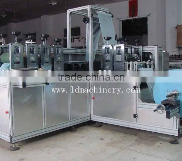 Non woven shoe cover making machine