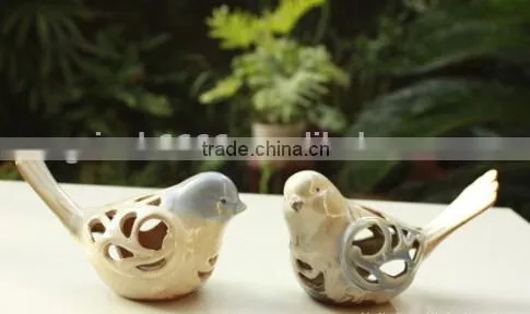 Ceramic bird home decoration with hollowed out shape