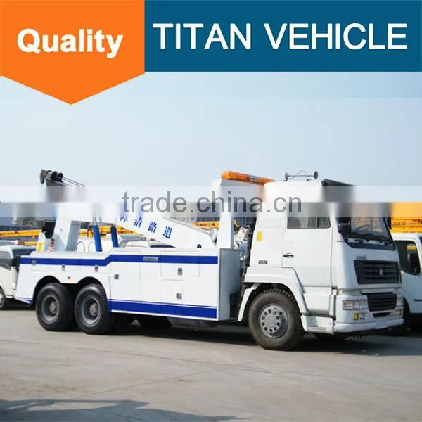 Sinotruck Howo Heavy Duty Flatbed Rotator Tow Truck Wrecker Wheel Lift for Sale With Arm Crane photo-5