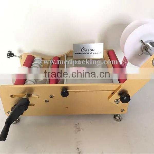Manual Round Bottle Sticker Label Machine Labels on Round Bottle/round Jar/cylinder photo-3