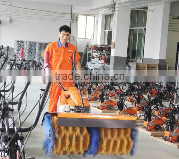 Hydraulic two wheel walking tractor with power sweeper