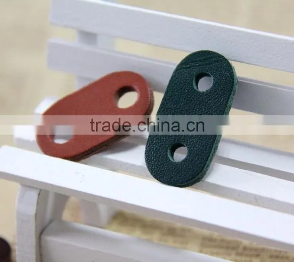 2014 Garment Customized Debossed 3d Faux Leather Cord Stoppers photo-3