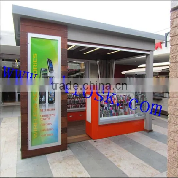 Outdoor mobile phone accessories kiosk with roller shutter door