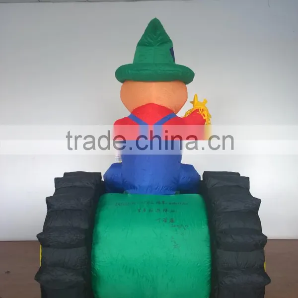 Animated Inflatable Farmer/Peasant Toy on Green Tractor With Yellow Wheels photo-2