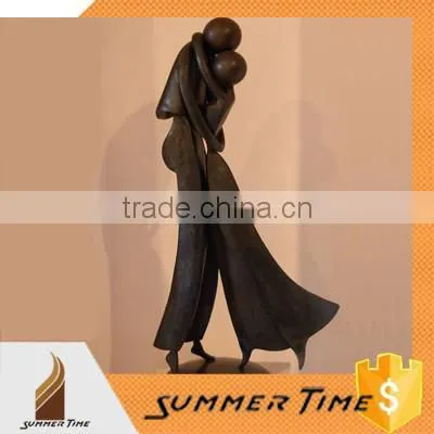 a couple locked in an embrace bronze indoor sculpture