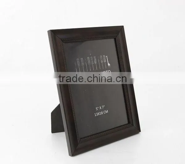 dark brown picture frame with easel on table dispaly