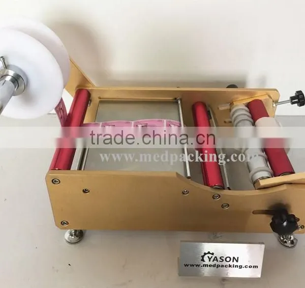 Manual Round Bottle Sticker Label Machine Labels on Round Bottle/round Jar/cylinder photo-2