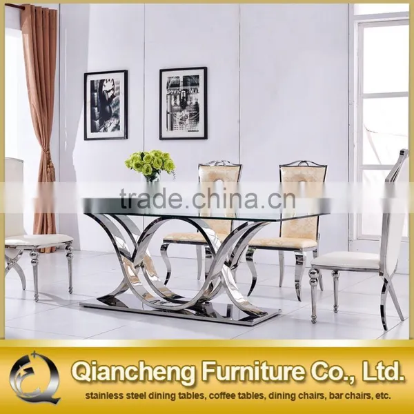 New Modle Tempered Glass Dining Room Stainless Steel Dining Table Set photo-2