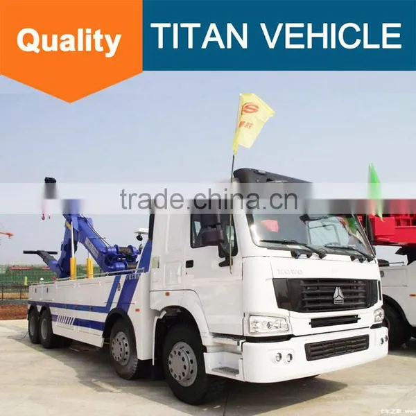 Sinotruck Howo Heavy Duty Flatbed Rotator Tow Truck Wrecker Wheel Lift for Sale With Arm Crane photo-2