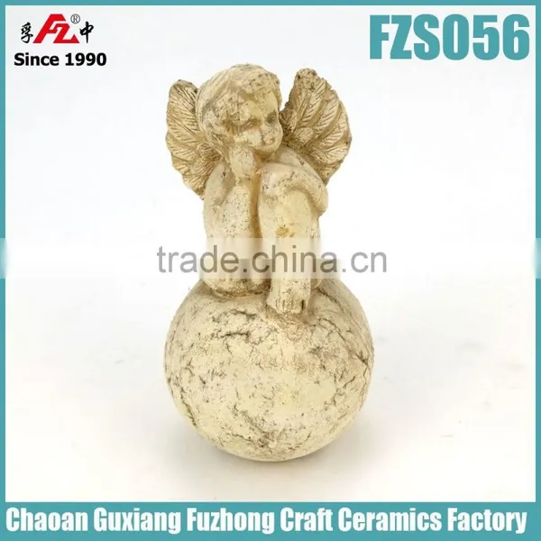 Shabby painting terracotta statue angel with ball for garden decoration