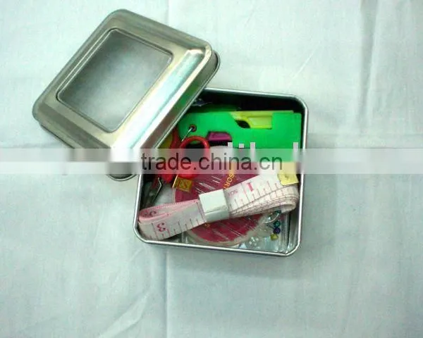 mini home sewing kit in a metal box