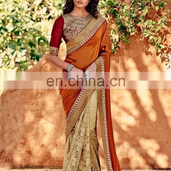 Mustard and Beige Colored Silk Crepe and Net Saree.