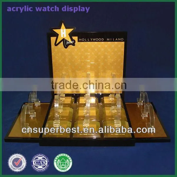 Golden acrylic watch display with C rings