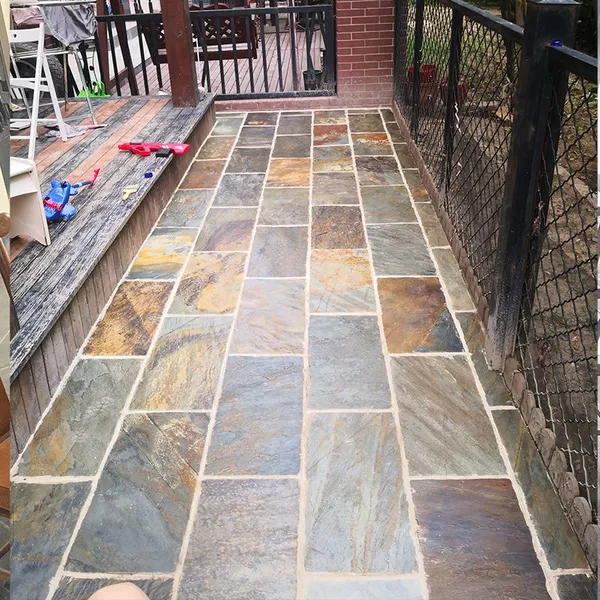 Natural Slate Courtyard Floor Tiles for Paving the Ground. Rusty and Warm-toned Garden Terrace Outdoor Homestay Floor Paved With Cultural Stones.