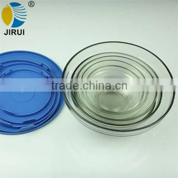 a Series of Glass Salad Bowls With Plastic Lids