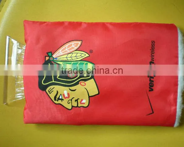 red ice scraper with glove