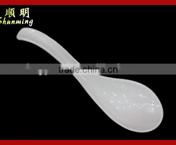 White plastic serving spoon