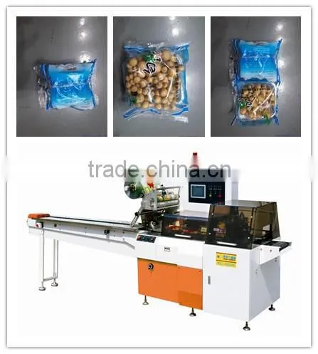 Edible mushrooms in tray reciprocating wrapping machine