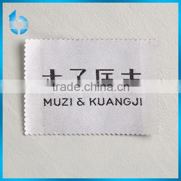 common woven label with laser processing for a woman coat