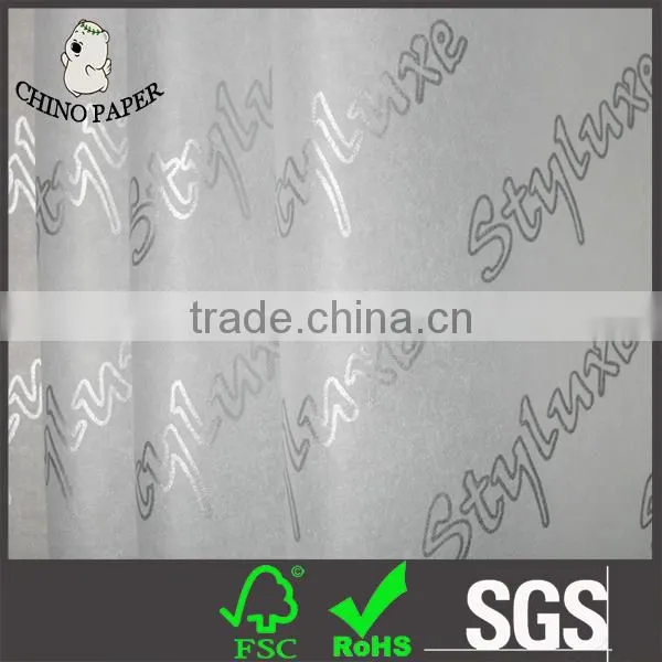 White Paper With Silver Logo Print Tissue Paper Wrapping photo-1